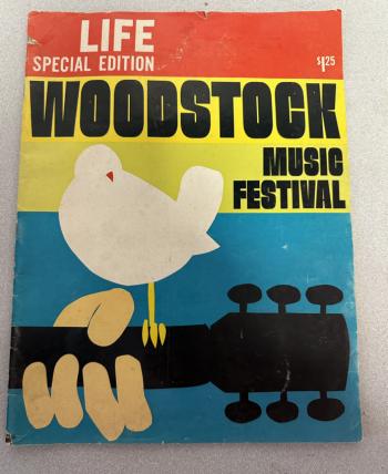 Image of Original Woodstock Magazine and unused ticket to the concert