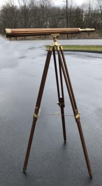 Large brass and wood telescope on tripod stand