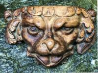 Baroque wood carving of a dog head