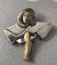 Vintage sterling silver brooch of a woman with a fish c1960