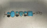 Silver turquoise and fossil bracelet by Charles Albert