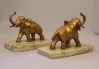 Gilt spelter elephant bookends on green onyx bases c1900