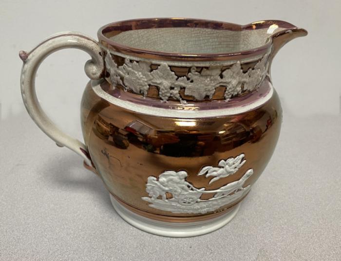 Staffordshire copper luster jug with putti and rams c1820