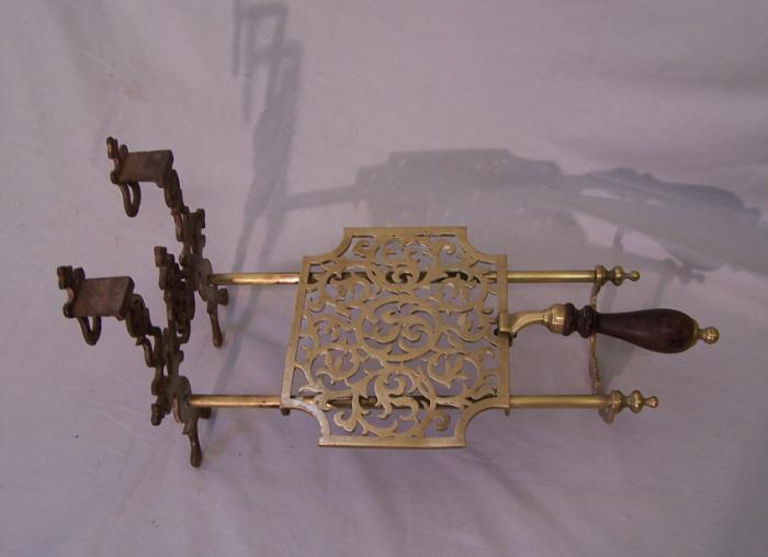 Antique English sliding brass fireplace trivet with hearts