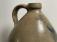 J Fisher Co Lyons NY stoneware jug with tulip