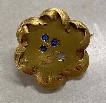 Image of 18K gold flower pin with sapphires and diamond
