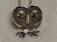 Whimsical owl pendant with stone eyes signed NBK in sterling silver