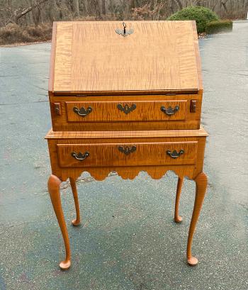 Image of Eldred Wheeler tiger maple desk in Queen Anne style