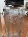 Set of antique kitchen canisters with tin tops