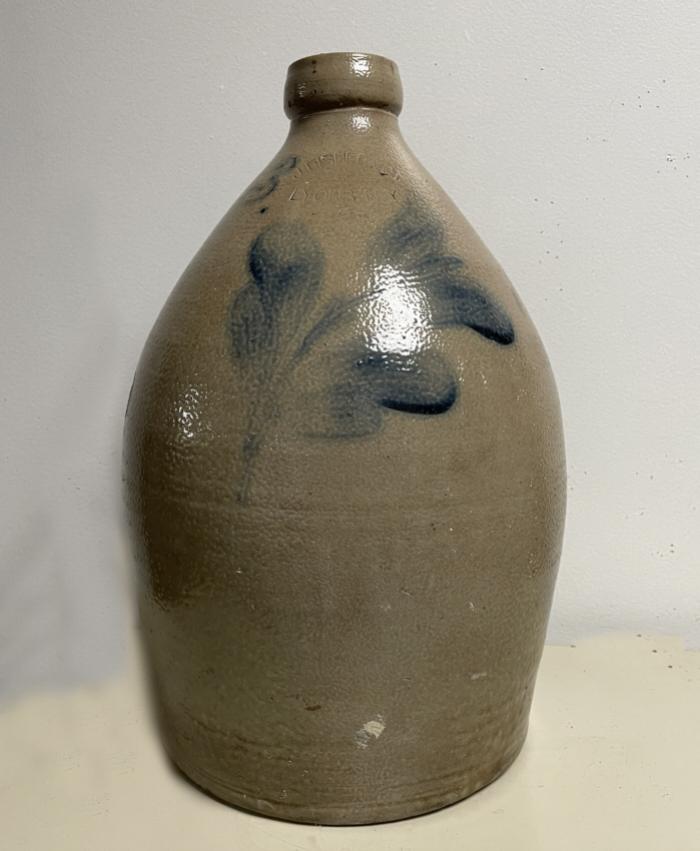 J Fisher Co Lyons NY stoneware jug with tulip