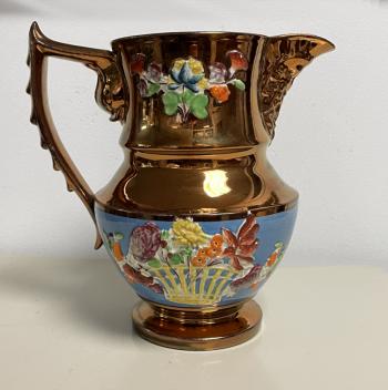 Image of Large copper luster pitcher with embossed flowers