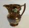 Large copper luster pitcher with embossed flowers