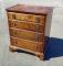 Diminutive tiger maple four drawer chest