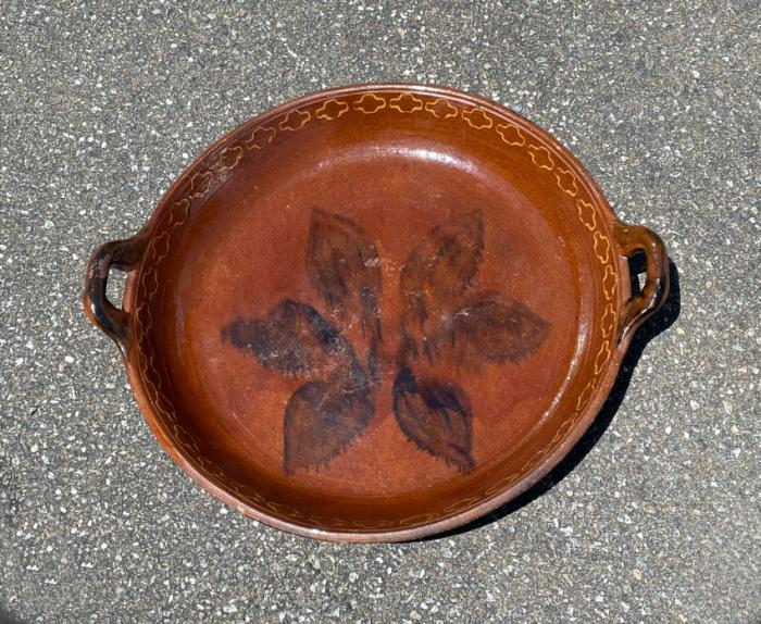 Antique redware bowl with slip design