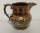 Large antique copper luster pitcher with enamel decoration