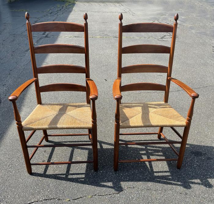 Shaker style pair of cherry arm chairs with rush seats