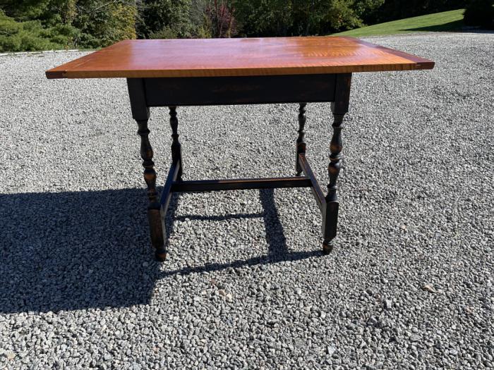 Hand made tiger maple table on black base