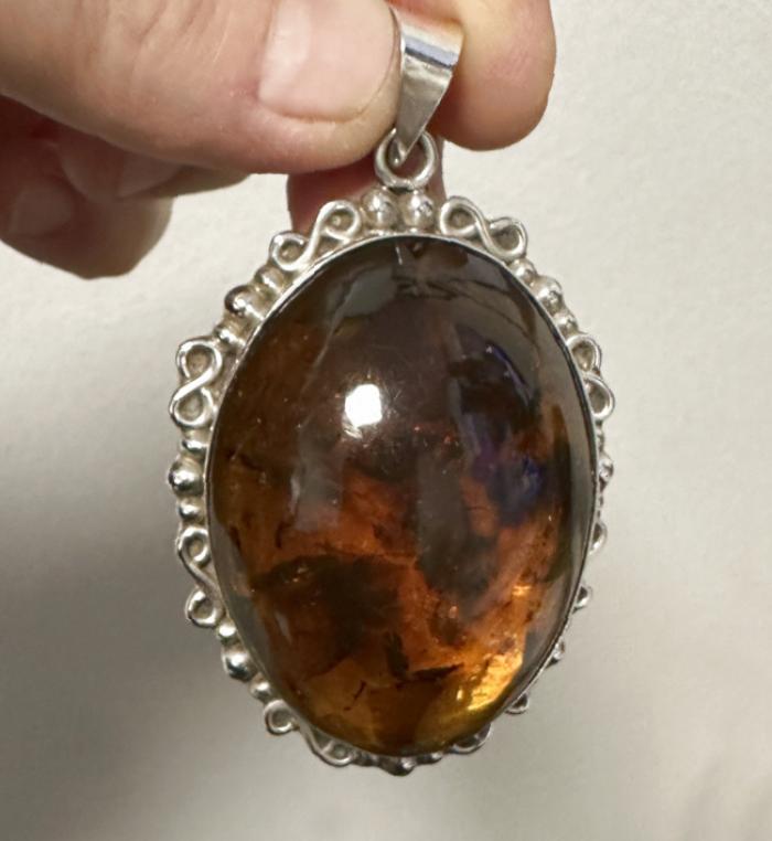 Large amber and silver pendant made in Mexico