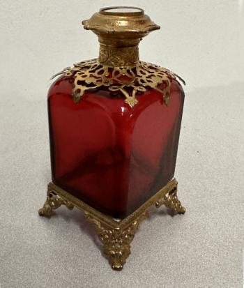 Image of French cranberry glass perfume bottle with gilt brass mounts