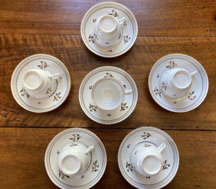 Six antique creamware cups and saucers