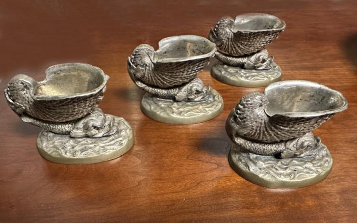 Set of four French dolphin salt cellars in nicklel silver 19thc