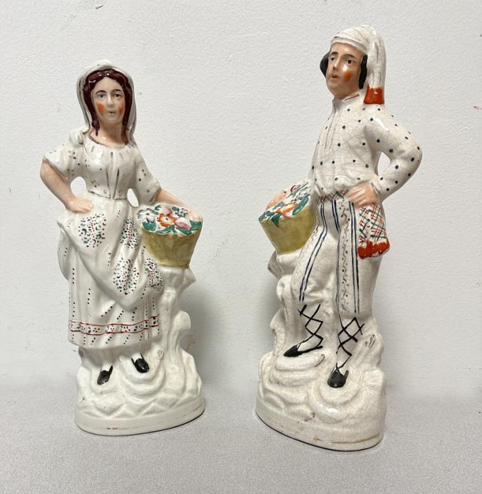 Staffordshire pair of flower seller figures