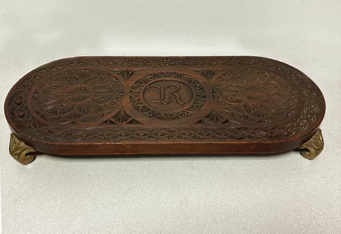 Chip carved walnut platform with bronze feet c1880