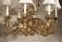 Pair hand wrought Italian gilt iron and tin chandeliers c1930