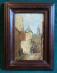 19th century European oil painting of village street signed Maguire