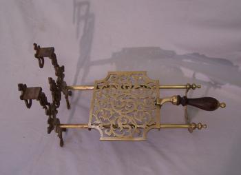 Image of Antique English sliding brass fireplace trivet with hearts