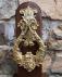 Large antique English brass door knocker with dolphins and figures
